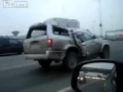 WTF Video: A Squashed Russian SUV Rolling Down the Highway